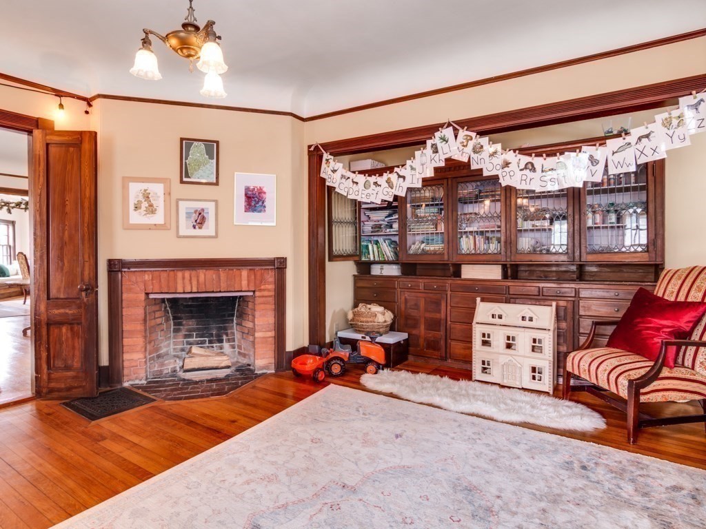 7 Emily Lane Gloucester, MA 01930 - Photo 19 of 41 a living room with furniture a fireplace and a flat screen tv