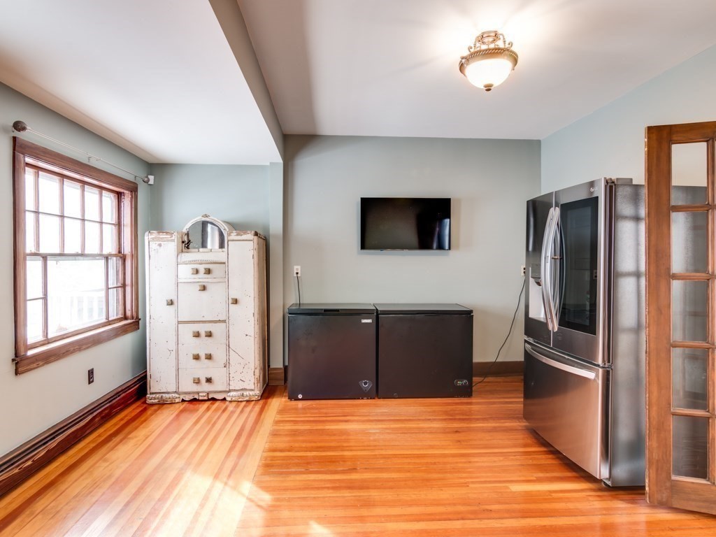 7 Emily Lane Gloucester, MA 01930 - Photo 20 of 41 a room with a bed and a flat screen tv