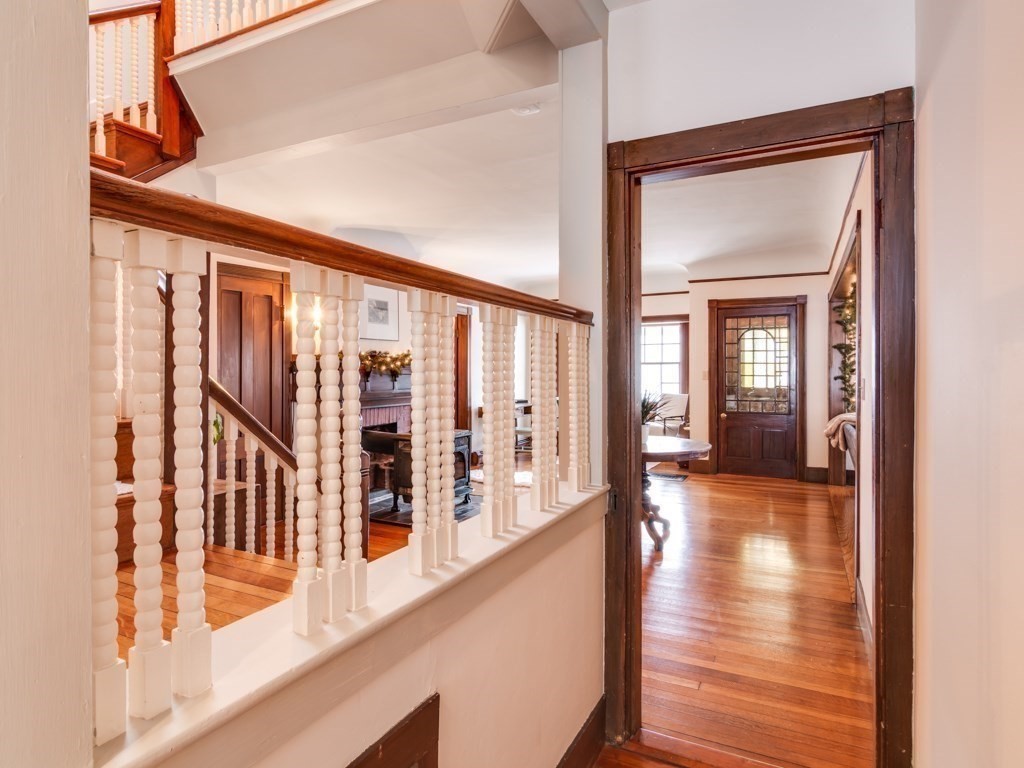 7 Emily Lane Gloucester, MA 01930 - Photo 23 of 41 a view of a hallway with wooden floor and windows