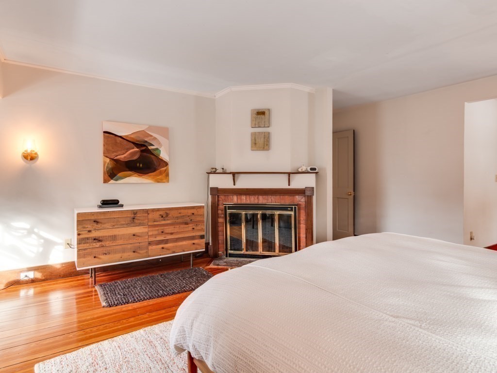 7 Emily Lane Gloucester, MA 01930 - Photo 27 of 41 a bed room with a bed and a painting on the wall