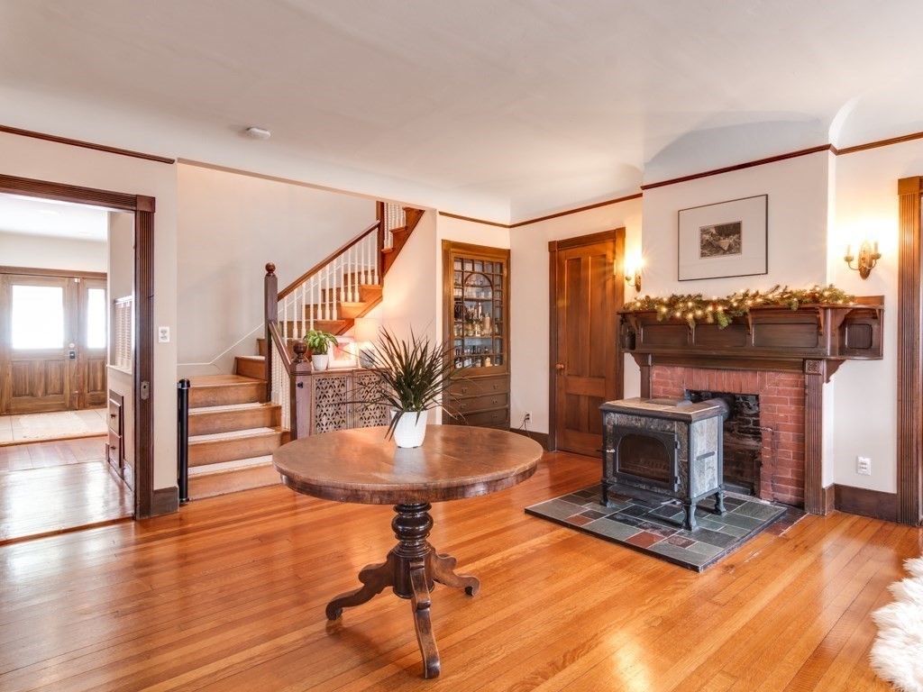 7 Emily Lane Gloucester, MA 01930 - Photo 3 of 41 a living room with furniture a fireplace and a table