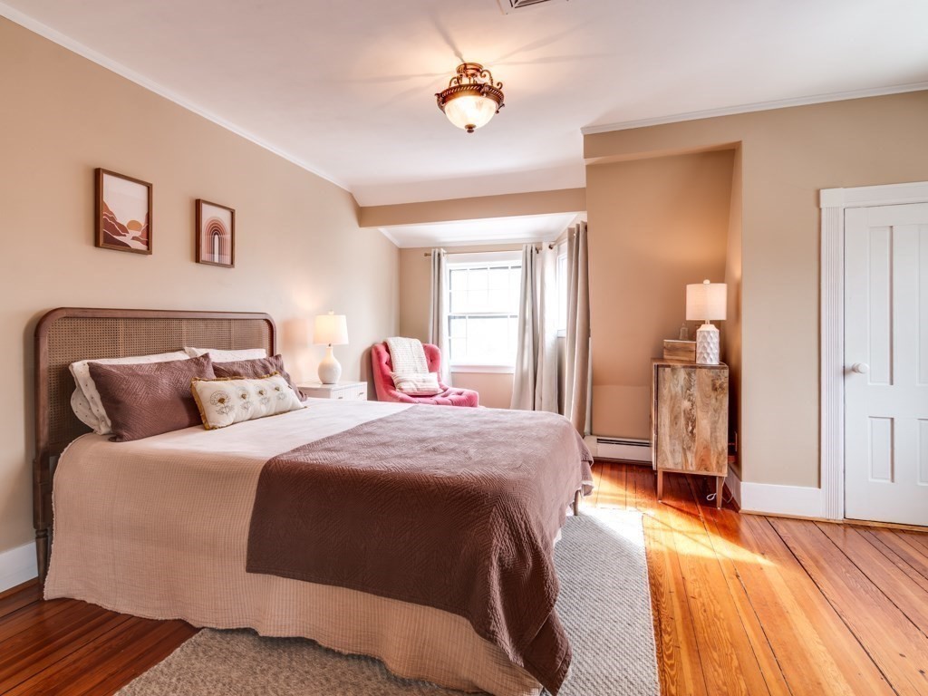 7 Emily Lane Gloucester, MA 01930 - Photo 35 of 41 a bedroom with a bed and wooden floor