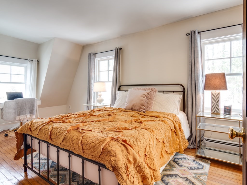 7 Emily Lane Gloucester, MA 01930 - Photo 39 of 41 a bedroom with a bed and window with lamp