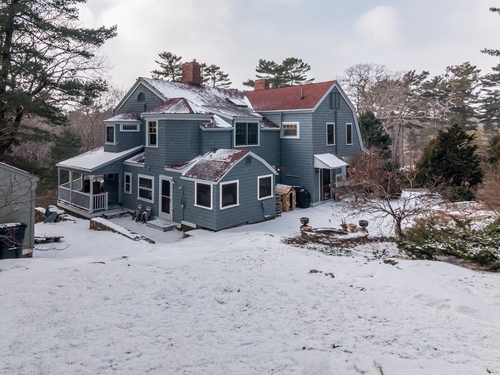 7 Emily Lane Gloucester, MA 01930 - Photo 40 of 41 a front view of a house with a dirt yard and a trees