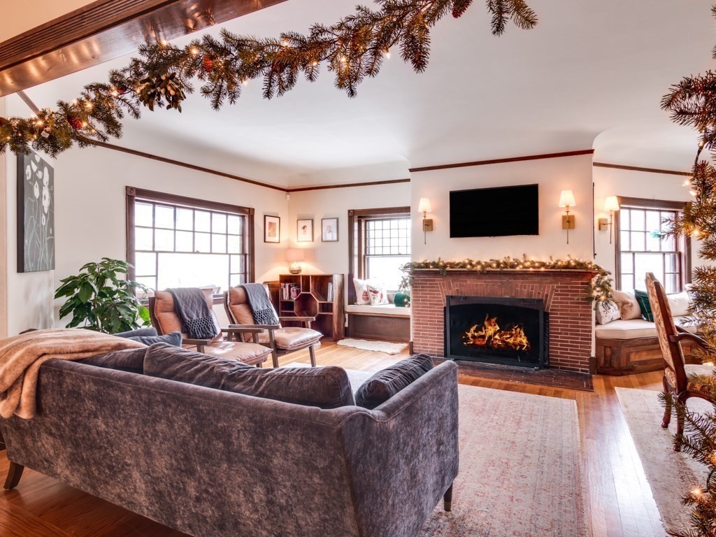 7 Emily Lane Gloucester, MA 01930 - Photo 5 of 41 a living room with furniture a flat screen tv and a fireplace