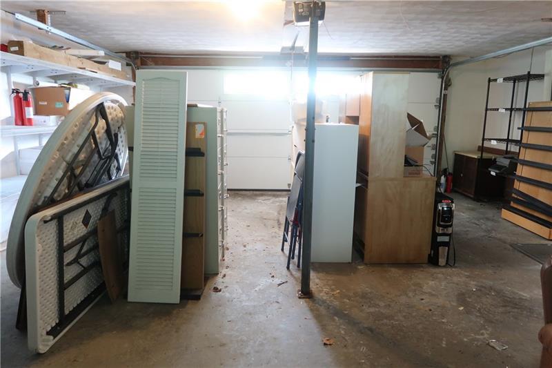 341 Story Road Export, PA 15632 - Photo 17 of 25 2 Car Attached Garage includes built in cabinetry, countertop, shelving, utility tub, workshop
