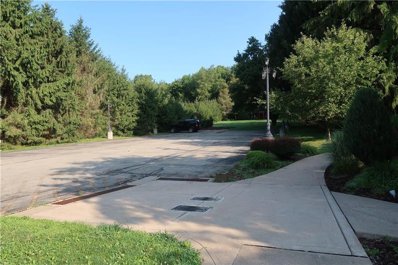 341 Story Road Export, PA 15632 - Photo 19 of 25 2 Large Paved Parking Lots 25 + approx. 15 cars, Lamp posts, drains all connected to walks