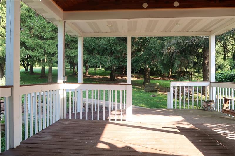341 Story Road Export, PA 15632 - Photo 21 of 25 BIG Covered Deck with vault ceiling, gorgeous fan and ramp surrounded with solitude