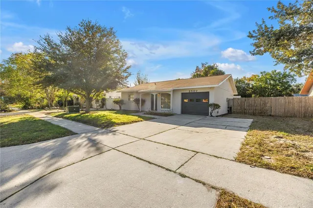 a view of a house with a yard