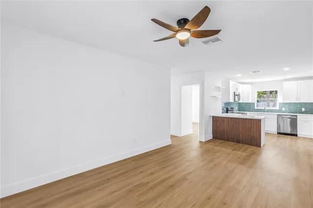 a view of kitchen with wooden floor and window