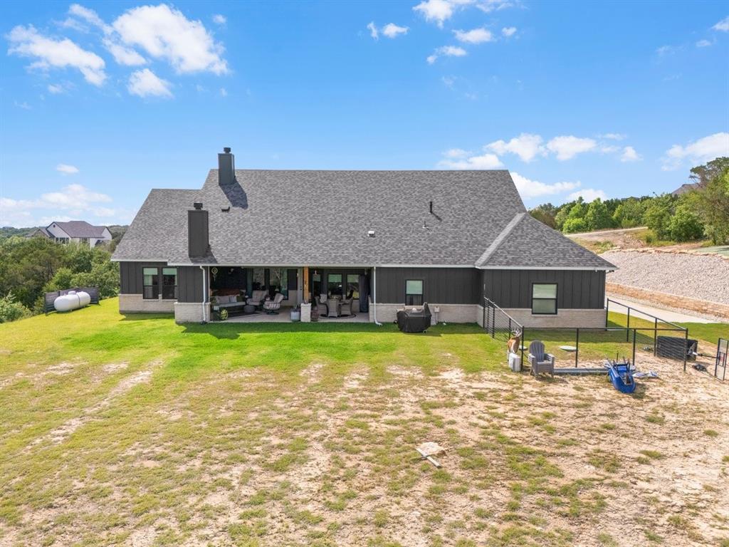 1059 Sweeney Way Weatherford, TX 76087 - Photo 29 of 37 Back of property featuring small, fenced area or dog run.
