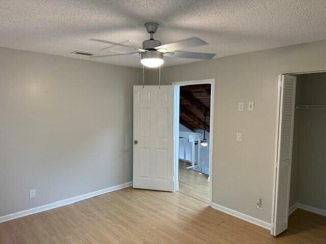 103 Northeast 28th Street Boca Raton, FL 33431 - Photo 31 of 47 wooden floor in an empty room with a bathroom