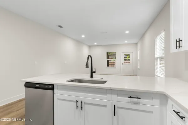a kitchen with a sink and a window