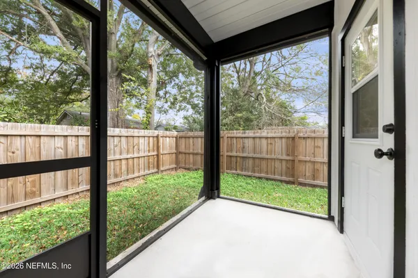 a view of a small house with a small garden