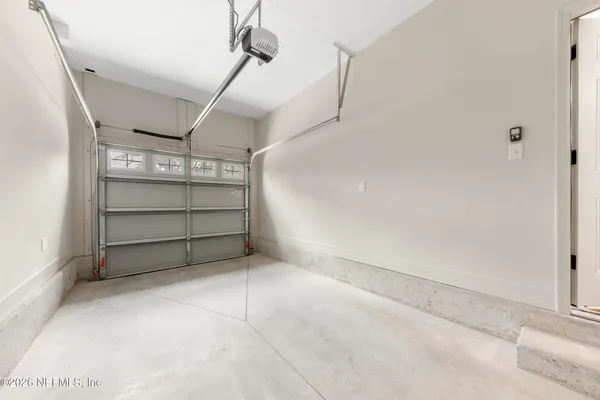 a picture of a bench in front of a white wall