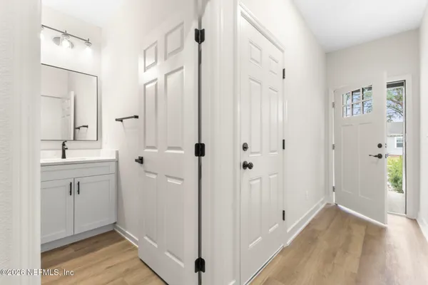 a bathroom with a double vanity sink and mirror