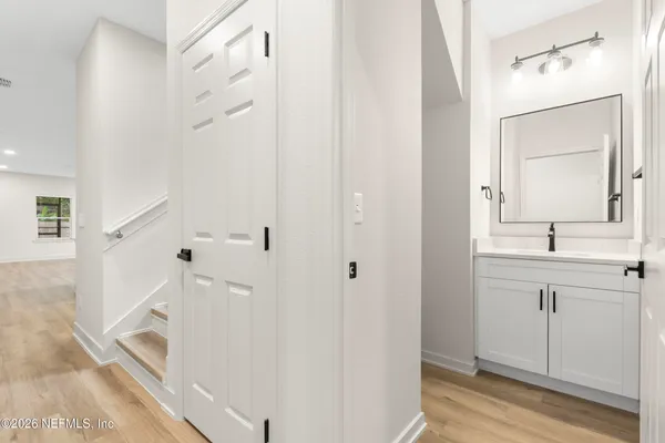 a bathroom with a double vanity sink mirror and