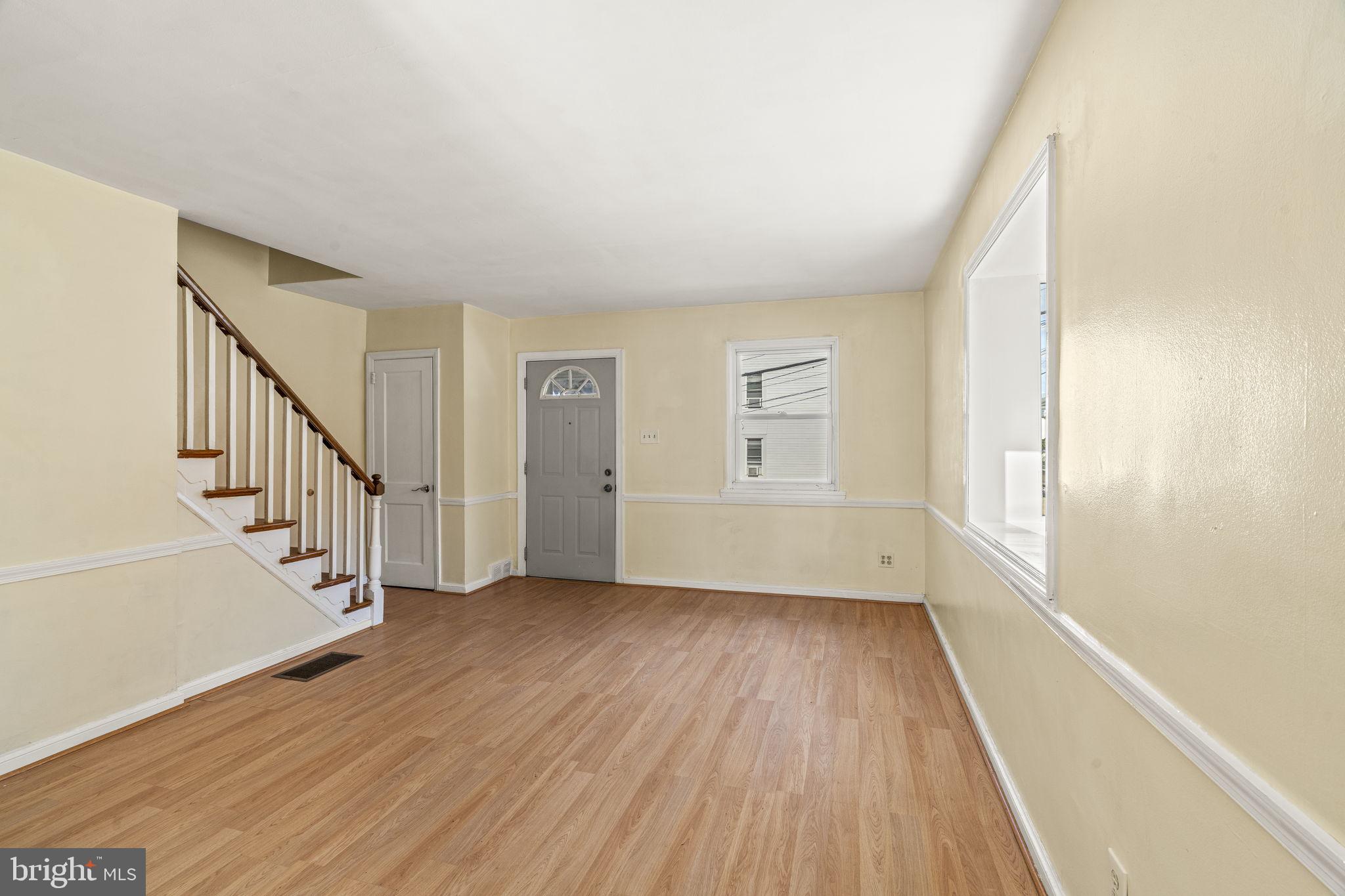 326 East Rambo Street Bridgeport, PA 19405 - Photo 5 of 23 a view of an empty room with wooden floor and a window