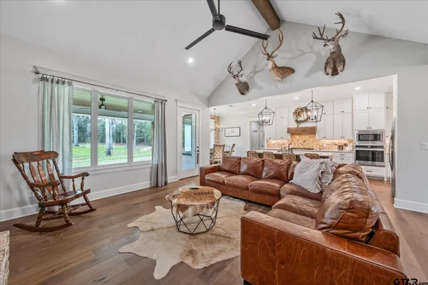 a living room with furniture and a large window