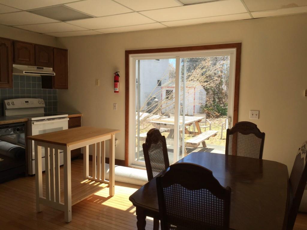 32 Main Street Castine, ME 04421 - Photo 4 of 16 Glass doors leading from kitchen to...