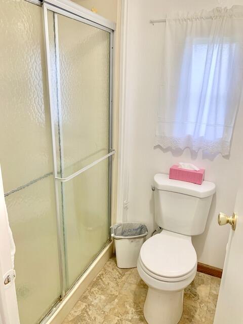 808 South Silver Circle Key Largo, FL 33037 - Photo 22 of 50 a bathroom with a toilet and a shower
