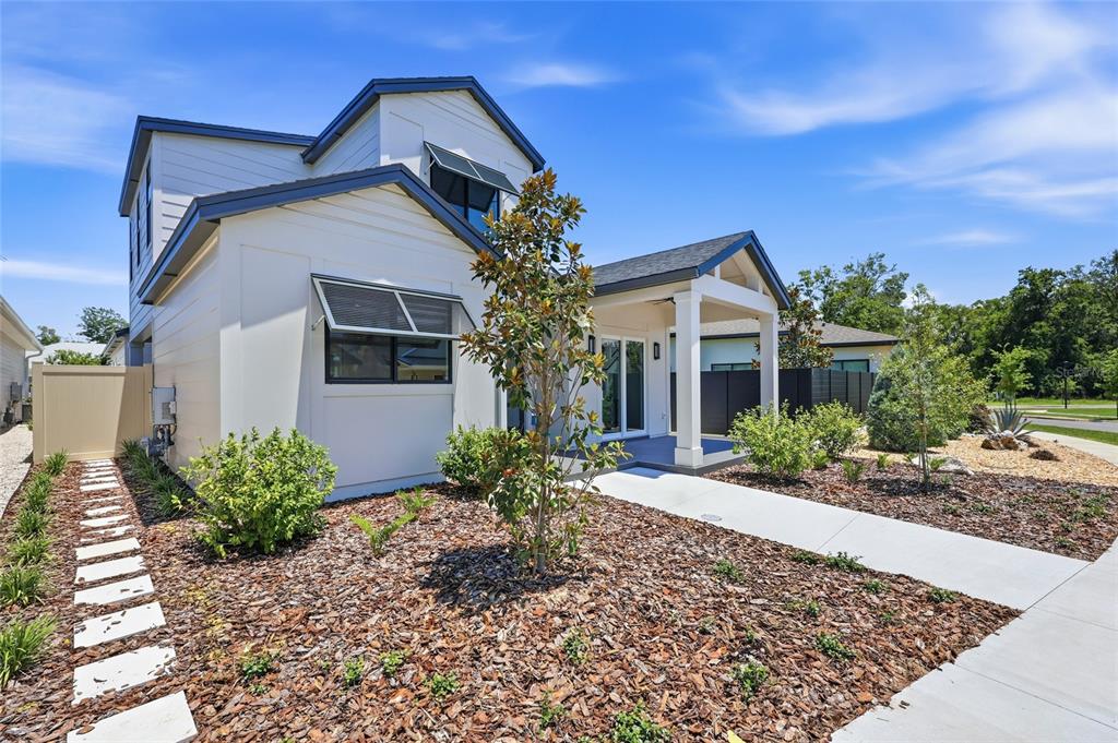 1063 Southwest 135th Way Newberry, FL 32669 - Photo 37 of 42 a front view of a house with garden