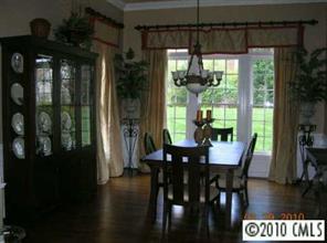 3421 Rhett Butler Place Charlotte, NC 28270 - Photo 3 of 8 a view of a dining room with furniture window and wooden floor