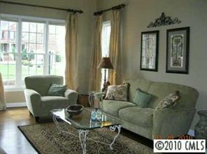 3421 Rhett Butler Place Charlotte, NC 28270 - Photo 4 of 8 a living room with furniture and a window