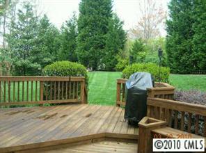 3421 Rhett Butler Place Charlotte, NC 28270 - Photo 8 of 8 a view of a wooden deck and a backyard