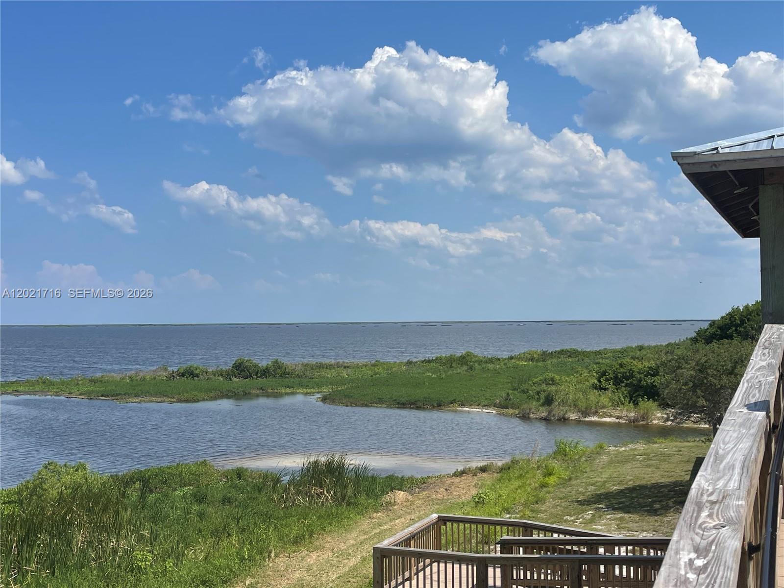 1326 Red Barn Rd N West Moore Haven, FL 33471 - Photo 8 of 13 a view of a lake from a yard