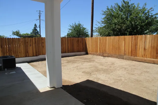 a view of outdoor space with wooden fence
