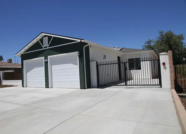 a front view of a house with garage