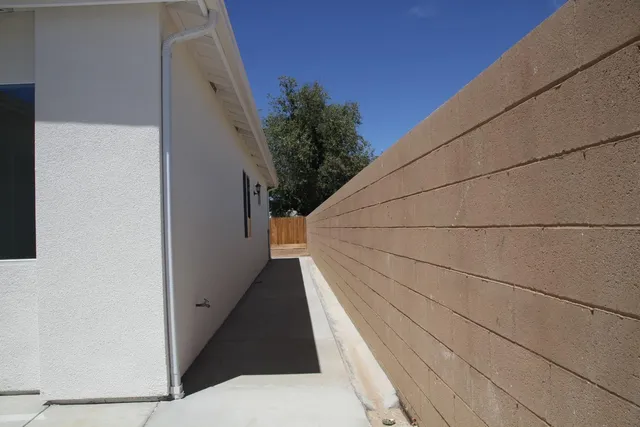 a view of balcony with wooden floor and wall