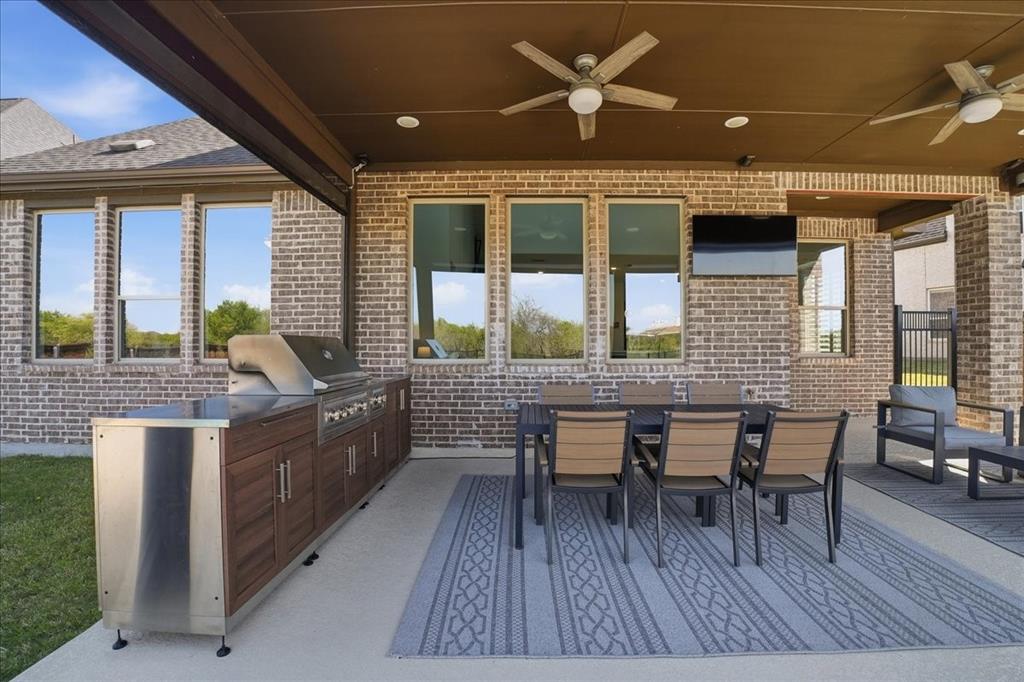 2721 Rotherham Street Prosper, TX 75078 - Photo 27 of 37 a dining room with wooden floor and furniture