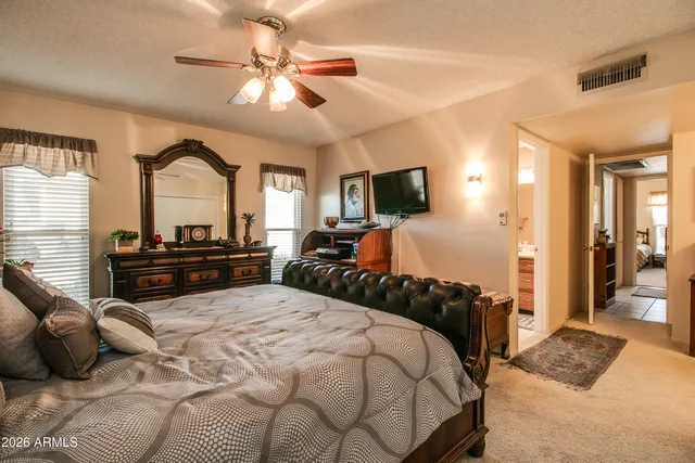 a bedroom with a bed furniture and a window