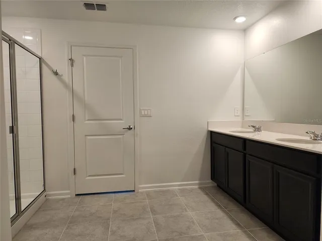 a bathroom with a sink and mirror
