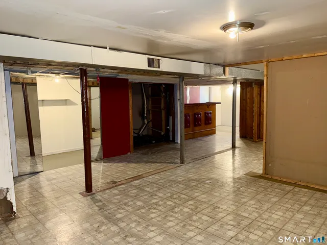 a view of a hallway with wooden shelves