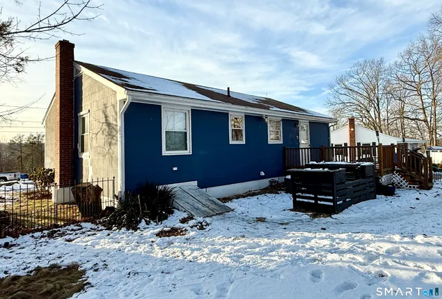 a backyard of a house with a yard covered in snow