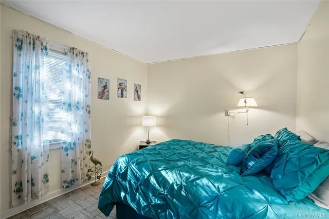 a bedroom with a bed and a walk in closet