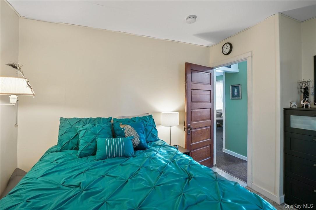 4 Montgomery Road, Unit 5 Fort Montgomery, NY 10922 - Photo 14 of 14 a bedroom with a bed and a hallway