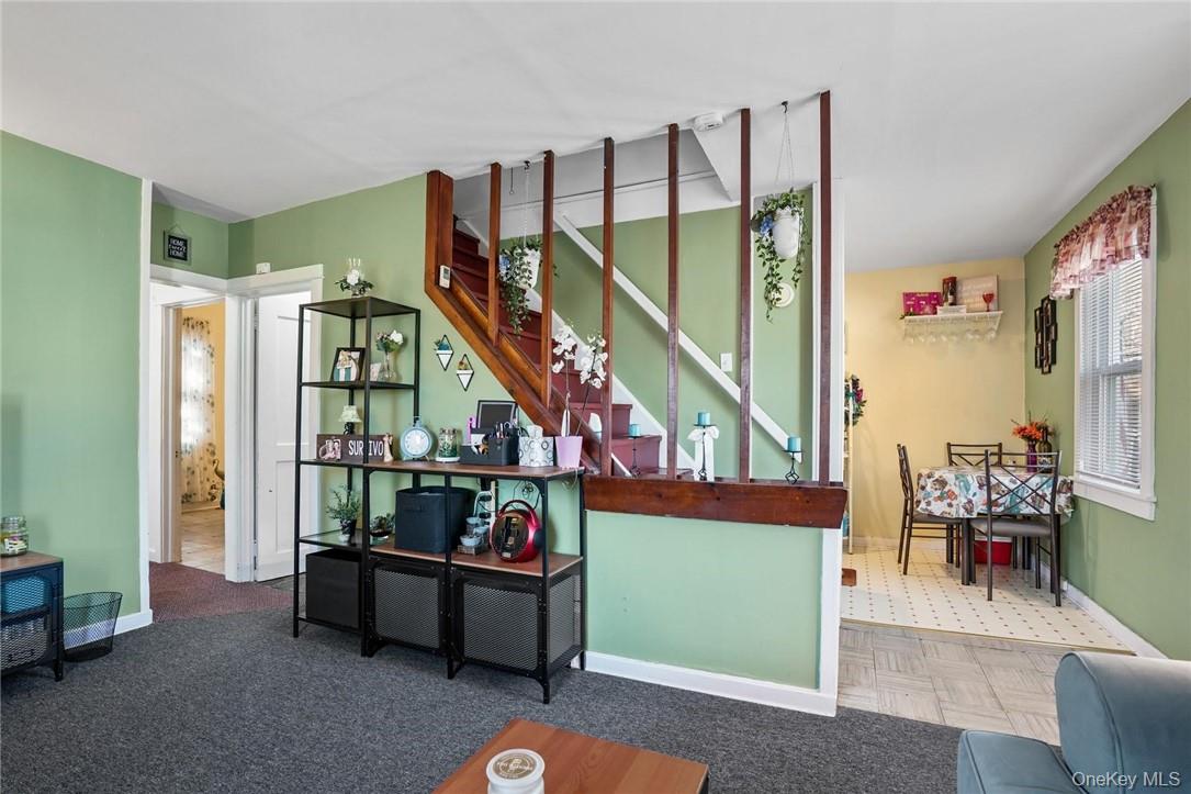 4 Montgomery Road, Unit 5 Fort Montgomery, NY 10922 - Photo 8 of 14 a living room with furniture and a painting on the wall