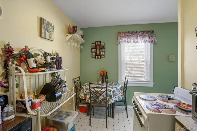 a work room with furniture and a window