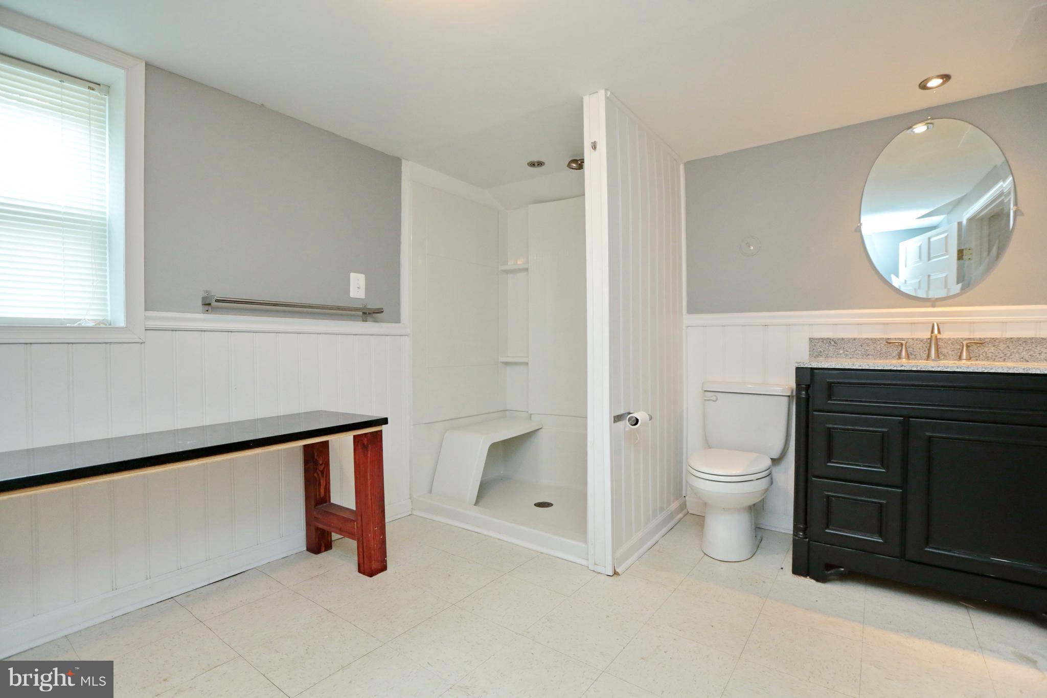 14613 Livingston Road Accokeek, MD 20607 - Photo 22 of 30 a bathroom with a toilet a sink and mirror