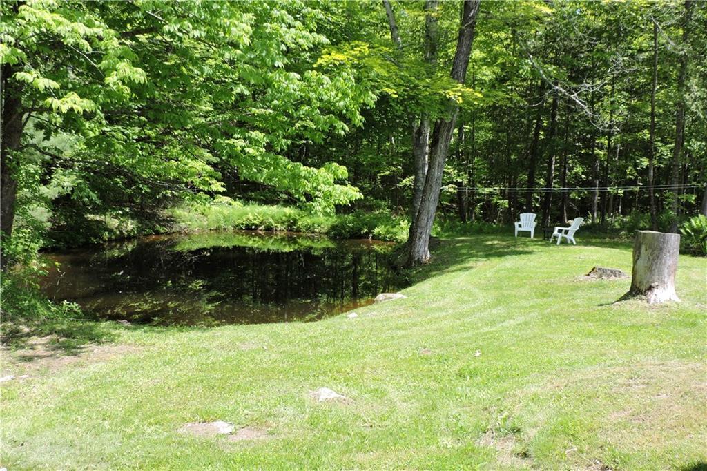 243 Pond Road Wayne, ME 04284 - Photo 2 of 33 Relax beside your farm pond
