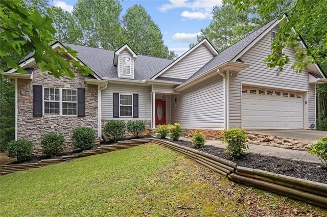 a front view of a house with garden