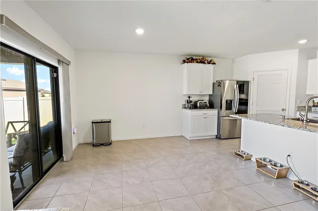 a kitchen with a sink stove and refrigerator
