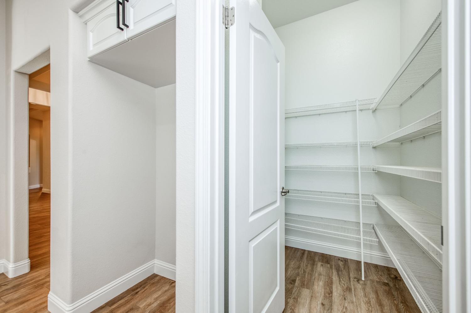 3252 Everglade Avenue Clovis, CA 93619 - Photo 11 of 31 a view of walk in closet with empty racks