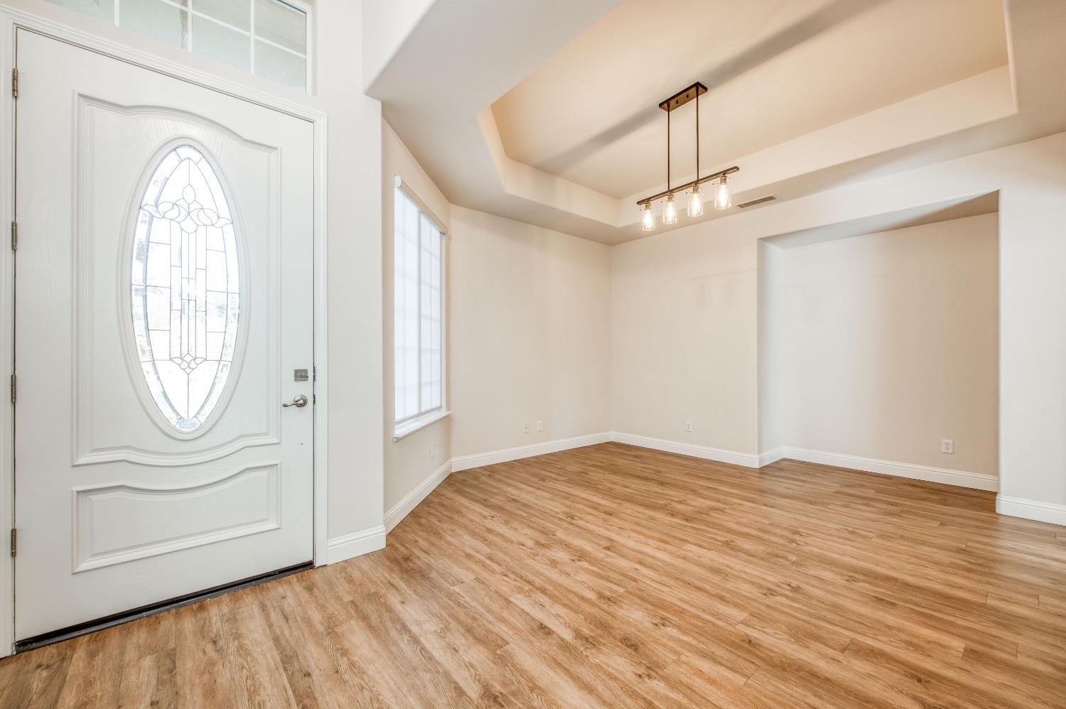 3252 Everglade Avenue Clovis, CA 93619 - Photo 13 of 31 a view of empty room with wooden floor and fan