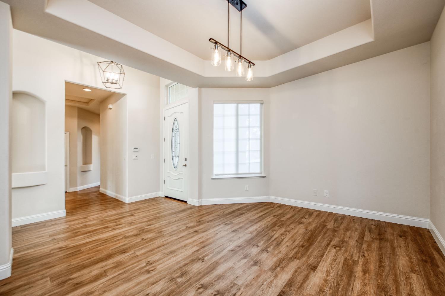 3252 Everglade Avenue Clovis, CA 93619 - Photo 14 of 31 a view of empty room with wooden floor and fan
