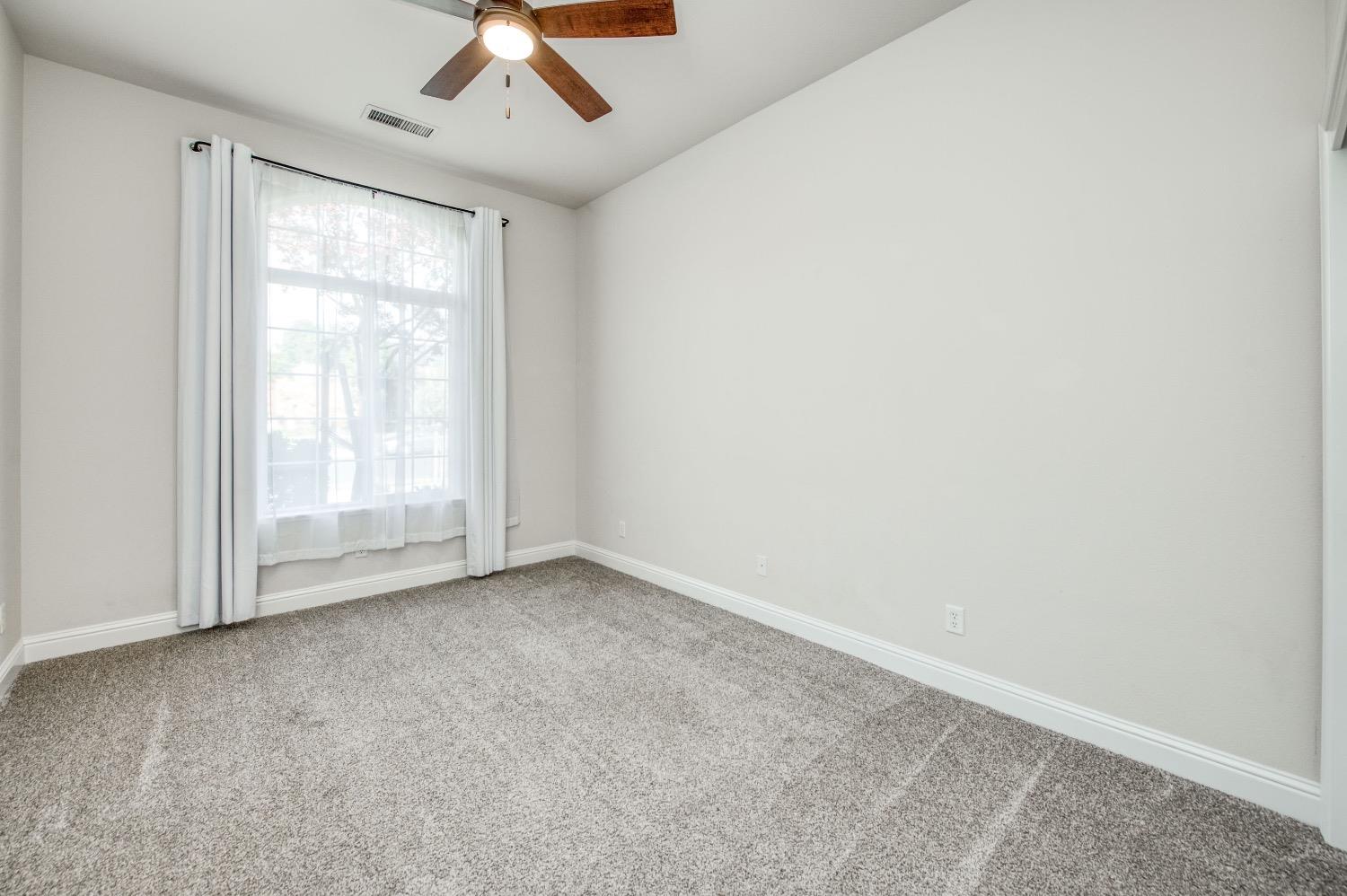 3252 Everglade Avenue Clovis, CA 93619 - Photo 19 of 31 an empty room with a window